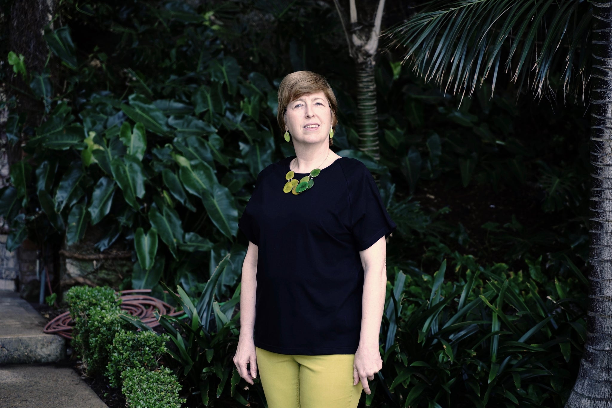 Woman wearing regular length black Flex-A-Tee
