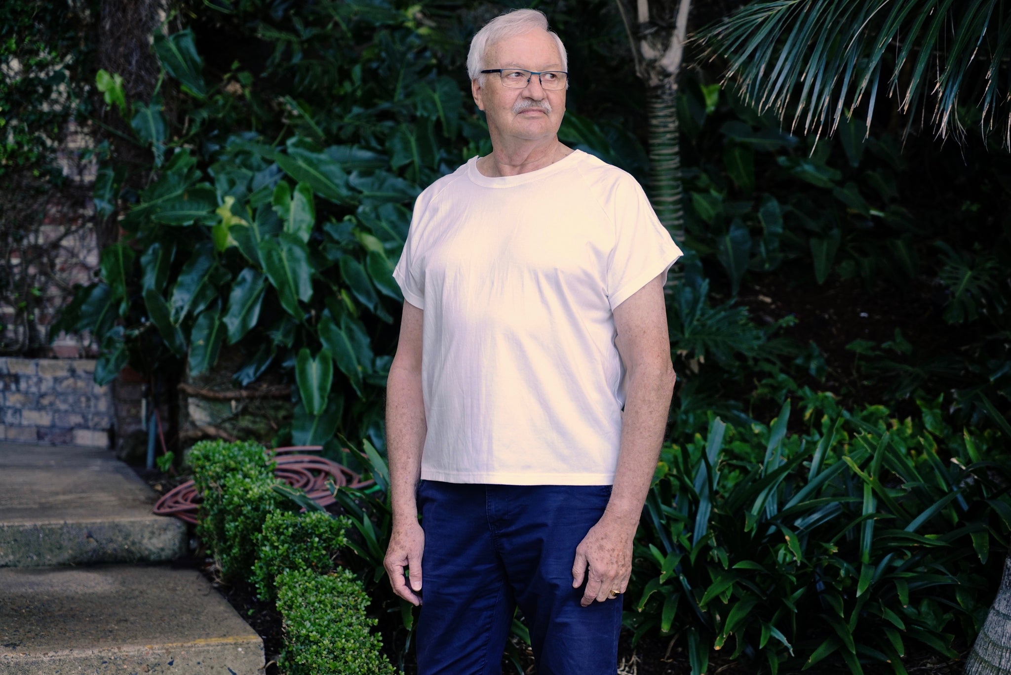 Man wearing white regular length Flex-A-Tee