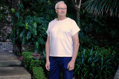 Man wearing white regular length Flex-A-Tee